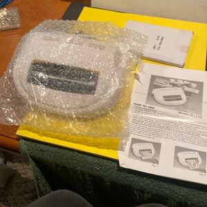 Laminating Machine, Instruction Booklet, and Package of Laminating Sleeves